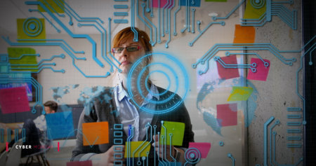 Image of circuit board patterns and circle, caucasian woman thinking and writing on sticky notes. Digital composite, connection, abstract, business, brainstorming, ideas, glass wall, office.の写真素材