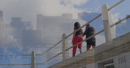 Image of infographic, buildings, african american woman with prosthetic leg walking with man. Digital composite, architecture, bridge, couple, together, disability, trading, report, business.の写真素材