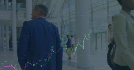 Image of financial data over caucaian businessmen walking in office. Global economy, finance,...