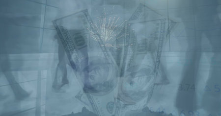 Image of fireworks exploding over low section of businesspeople walking against american dollars. Global economy and business technology conceptの写真素材