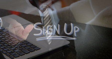 Image of icons, sign up text, midsection of man touching screen, cropped hands working on laptop. Digital composite, multiple exposure, diverse, push button, business, social media and technology.の写真素材