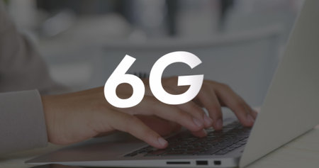 Image of 6g text over hands using laptop. Global business and digital interface concept digitally...