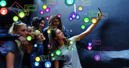 Image of social media icons and data processing over diverse people using smartphone. Global social media, business, finance, computing and data processing concept digitally generated image.の写真素材