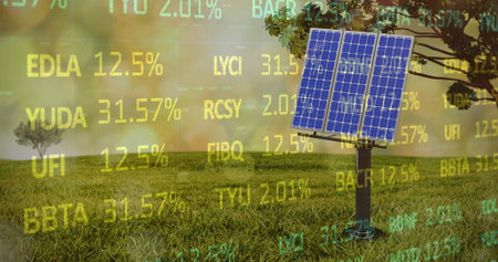 Image of solar panel on grassy field over moving trading board. Digital composite, multiple exposure, stock market, investment, nature, solar energy, electricity, green technology, sustainability.の写真素材