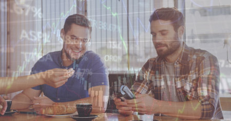 Image of trading board and graphs over biracial barista giving credit card reader to customers. Digital composite, multiple exposure, report, stock market, banking, technology, paying concept.の写真素材