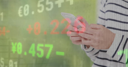 Image of financial data processing over caucasian woman using smartphone. Global business, networks, connections, computing and data processing concept digitally generated image.の写真素材