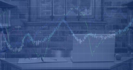 Image of multiple graphs moving over laptop with report and eyeglasses placed on desk in office....