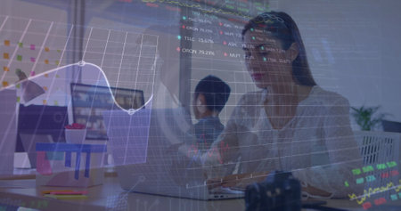 Image of globe, graph, numbers and trading board over caucasian woman working on laptop. Digital composite, multiple exposure, stock market, investment, report, finance and technology.の写真素材