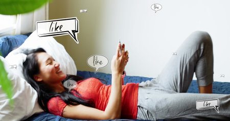 Image of social media text in speech bubbles over asian woman using smartphone. Global technology, social media and digital interface concept digitally generated image.の写真素材