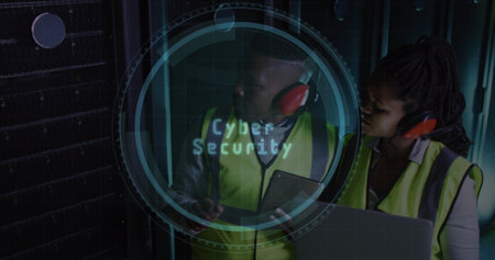 Image of web globe over african american male and female engineer using laptop at server room. Cyber...
