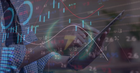 Image of statistical and stock market data processing over mid section of man using tablet. Global...