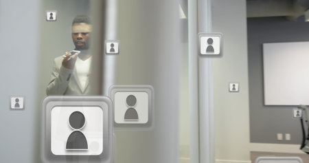 Image of social media icons and data over african american businessman using smartphone. Global social media, business, finances, computing and data processing concept digitally generated image.の写真素材