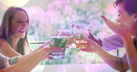 Image of spots over happy diverse friends with drinks. world cocktail day and celebration concept...