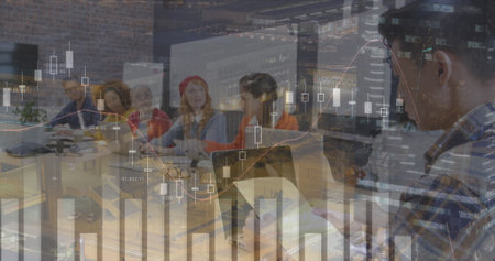 Image of finance data over group of diverse businesspeople working with technology in office....