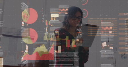 Image of financial data processing over caucasian businesswomen. Global business, finances, data processing and digital interface concept digitally generated image.の写真素材
