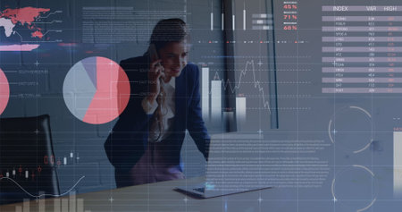 Image of statistics and data processing over man using computer. Finance economy technology and digital interface digitally generated image.の写真素材