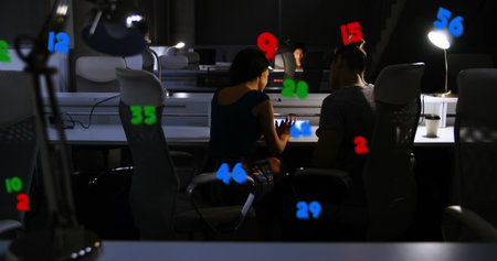 Image of numbers processing over diverse business people in office. Global business, finances, computing and data processing concept digitally generated image.の写真素材