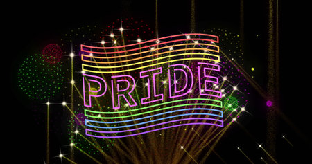 Image of pride rainbow text and flag and fireworks exploding on black background. Pride month, lgbtq, human rights and equality concept digitally generated image.の写真素材