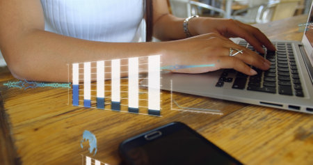 Image of graphs, globes, computer language, midsection of caucasian woman working on laptop. Digital composite, multiple exposure, report, business, globalization and technology concept.の写真素材