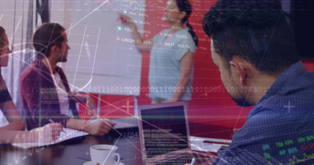 A diverse group of professionals is working together, analyzing data on screens. They are in office...