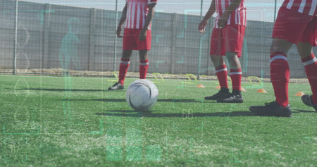 Image of data processing over kicking ball football player. Sports, competition, entertainment and technology concept digital composite digitally generated image.の写真素材