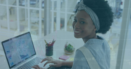 Image of financial data processing over biracial businesswoman in office. Global business, finance,...