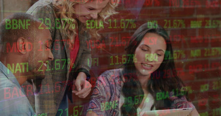 Image of stock market data processing over diverse colleagues discussing over digital tablet. Global economy and business technology conceptの写真素材