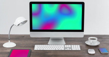 Image of technological devices with colorful moving shapes on screen on desk. Global technology, abstract background and digital interface concept digitally generated image.の写真素材