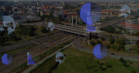 Image of round scanners and data processing against aerial view of cityscape. Computer interface and business technology conceptの写真素材