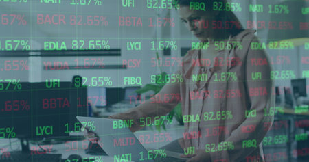Image of stock market data processing over thoughtful caucasian woman using laptop at office. Global...