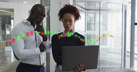 Image of financial data processing over diverse business people in office. Global finance, business, connections, computing and data processing concept digitally generated image.の写真素材