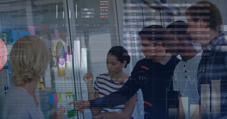 Image of data processing over diverse business people talking. Global business and digital interface...