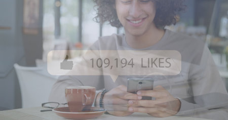 Image of social media icons over biracial men using smartphone. Social media and communication concept digitally generated image.の写真素材