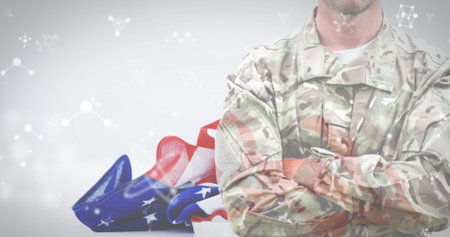 Image of midsection of army soldier with nucleotides and national flag of america. Digital composite, multiple exposure, genetic, military, patriotism, freedom and identity concept.の写真素材