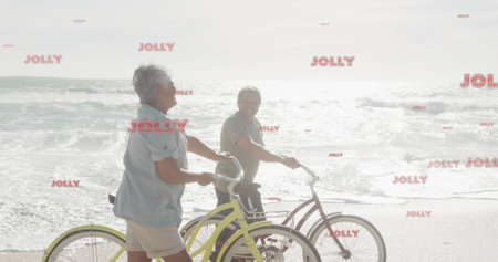 Image of jolly texts over senior biracial couple at beach. Christmas, celebration and digital interface concept digitally generated image.の写真素材