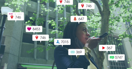 Image of media icons over biracial woman with face mask using smartphone. Global business and...