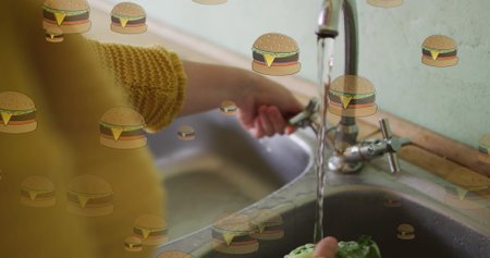 Image of hamburger icons over caucasian woman washing salat. Family, food and digital interface...