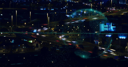 Image of data processing and globe over city at night. Global business and digital interface concept digitally generated image.の写真素材