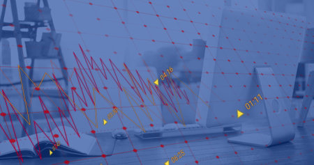 Image of financial data processing against close up of a desk at office. Global finance and business...