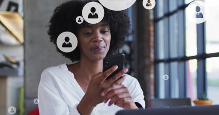 Image of profile icon in circles over biracial woman laughing and talking on cellphone. Digital...