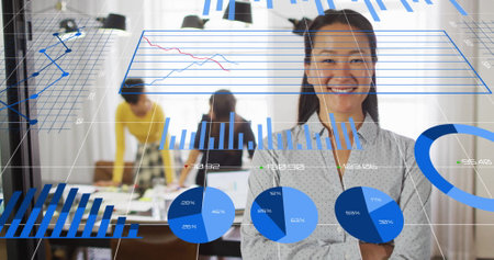 Image of multiple graphs and changing numbers over smiling asian woman standing arms crossed. Digital composite, multiple exposure, report, office, growth, digits and business conceptの写真素材