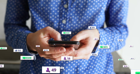 Image of social media text and icons over caucasian man with smartphone at home. Global social...