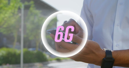 Image of 6g text over biracial man using smartphone. Social media and digital interface concept digitally generated image.の写真素材
