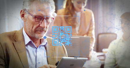Image of qr code and connected dots over senior caucasian businessman using tablet in office. Digital composite, multiple exposure, networking, finance, technology, executive, focused.の写真素材