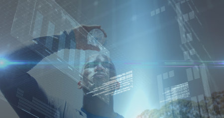 Image of data processing over african american man with water. Global sport and digital interface concept digitally generated image.の写真素材
