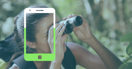 Image of smartphone icon over caucasian woman using binoculars. Sport, shopping and retail concept digitally generated image.の写真素材