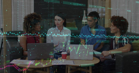 Image of financial data processing over team of diverse colleagues discussing together at office....