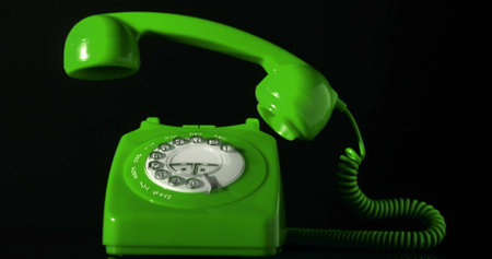 Image of green phone on black background. social media and communication interface concept digitally generated image.の写真素材
