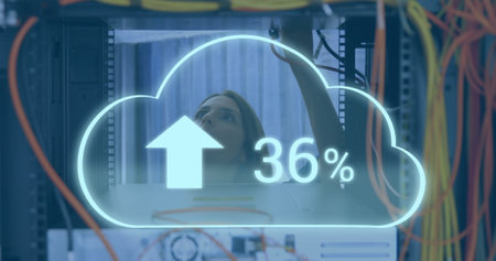 Image of clouds icon over caucasian female worker inspecting server room. global technology and...