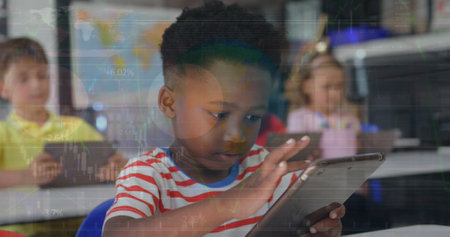 Image of african american cute boy using digital tablet in classroom over infographic interface. Digital composite, multiple exposure, childhood, data, reports, investment, technology, e-learning.の写真素材